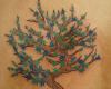 Tatuaje de arbol con hojas
