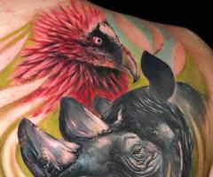 Rhino and bird tattoo