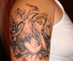 Tattoo on his shoulder: Alice in Wonderland