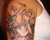 Tattoo on his shoulder: Alice in Wonderland