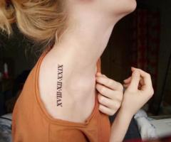 Roman numeral tattoos of family births