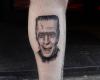 Tatuaje de Herman Munster en la pierna