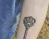 Tatuaje de llave en antebrazo