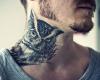 Owl tattoo on neck