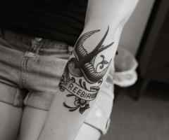 Free bird tattoo