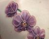 Tatuaje de flores orquideas