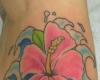 Hawaiian hibiscus and waves tattoo
