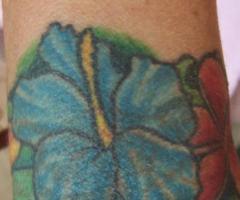 Hawaiian flower armband tattoo