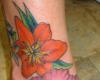 Hawaiian flower foot tattoo