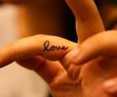 Love tattoo on fingers