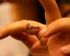 Love tattoo on fingers