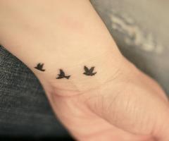 Três pequenas aves tatuagem