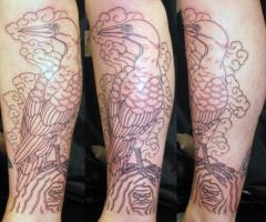 Gannet and rocky Daruma tattoo