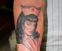Pin up nurse art tattoo