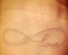White ink tattoos on tan skin