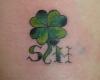 Four leaf clover tattoo with initials