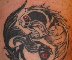 Black and White Fish Yin Yang tattoo