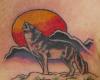 Howling wolf and moon tattoo