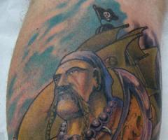 Color tattoo of pirate warrior guy
