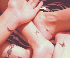 Butterfly hand friends tattoos
