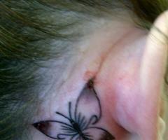 Butterfly behind the ear
