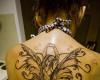 Beautiful large fairy tattoo on her upper back