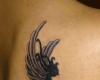 Tatuaje de hada en la espalda