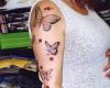 Tatuaje de mariposas y un angel mujer