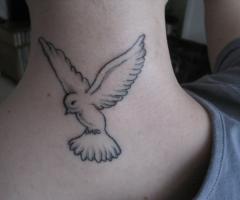 Bird tattoo on neck