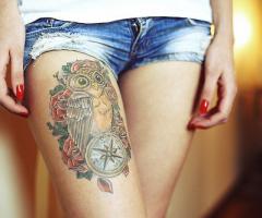 Owl and roses on leg