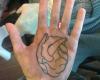 Realistic heart in hand