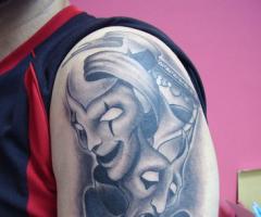 Theatre masks tattoo