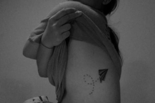 Paper plane tattoo