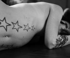 Belly button star tattoo