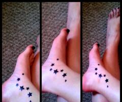 Tattooed girl star tattoo on foot