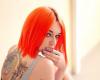 Red hair color model dragon back tattoo