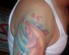 Tatuaje de pez Koi en el brazo