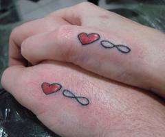 Two heart and two infinity tattoos