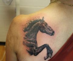 Jumping horse tattoo