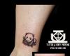 Tatuaje de oso panda en el tobillo