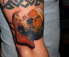 skull with guitar tattoo