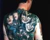 Tatuaje de la banda Kiss en la espalda