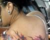 Hello Kitty and cherry blossom tattoo
