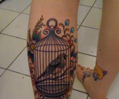 Bird cage tattoo