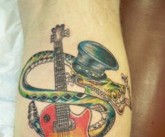 Slash as snake guitar tattoo
