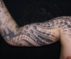 Biomechanical arm tattoo