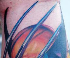Wolverine cartoon tattoo