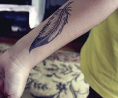 Feather on forearm