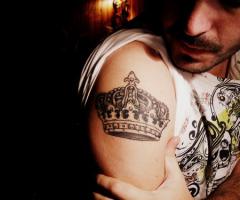 Black and white crown tattoo