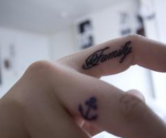 Family and anchor on fingers
